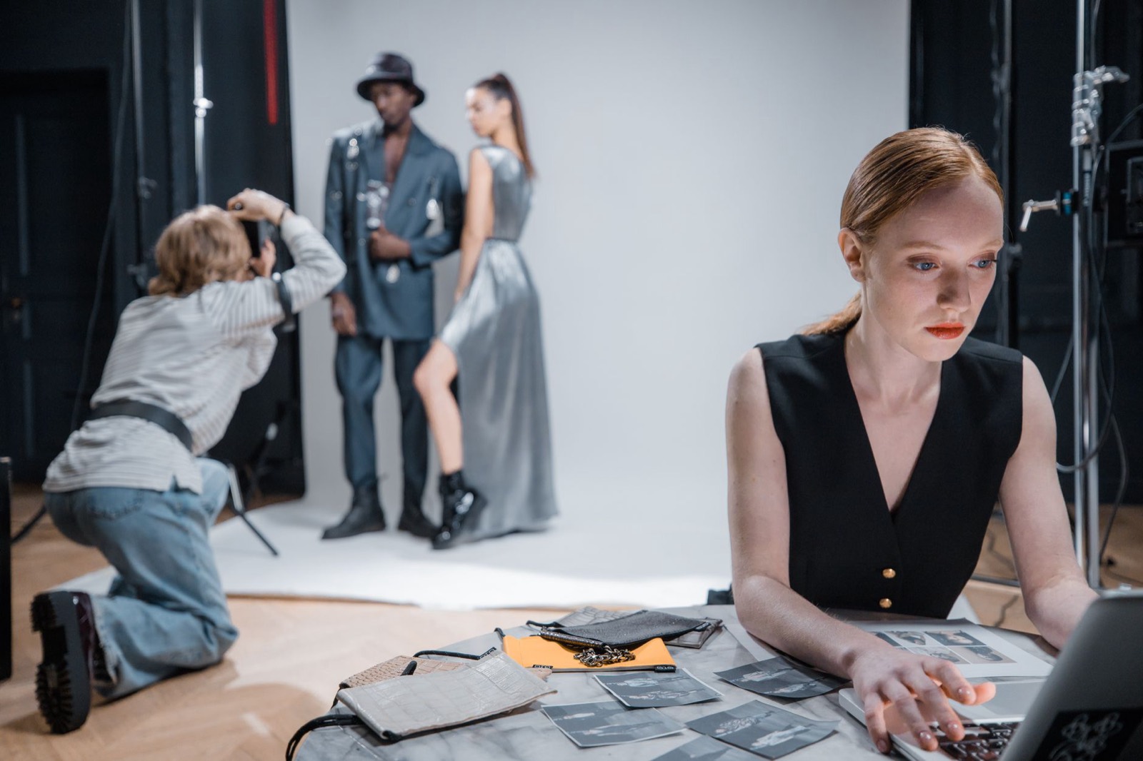 A fashion shoot in progress, the photographer in the foreground