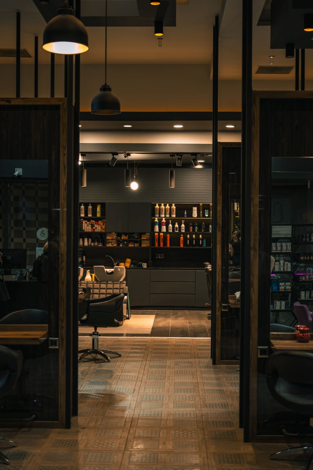The studio at night, lit shelves and a chair