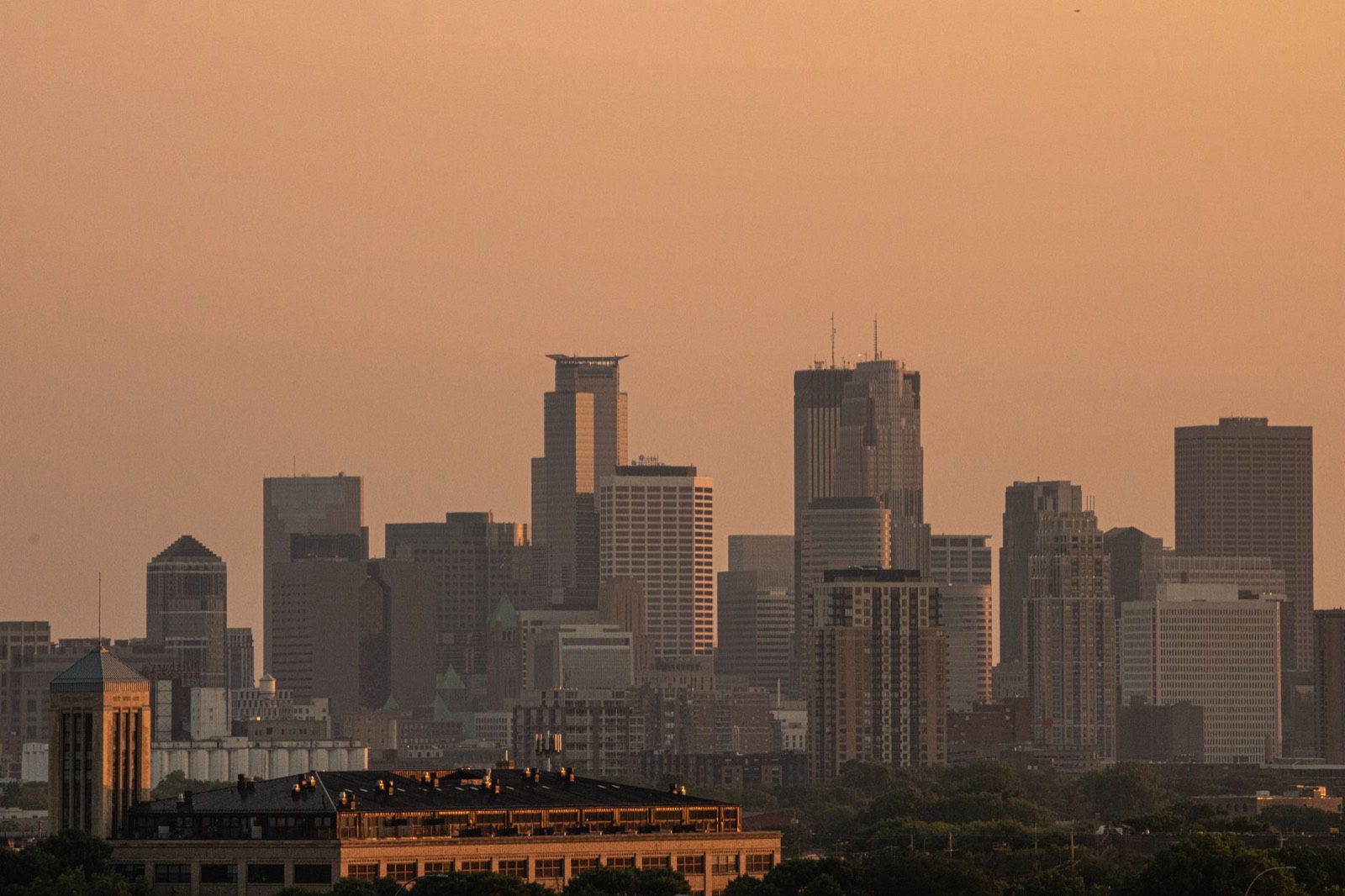 The Minneapolis skyline in amber evening haze