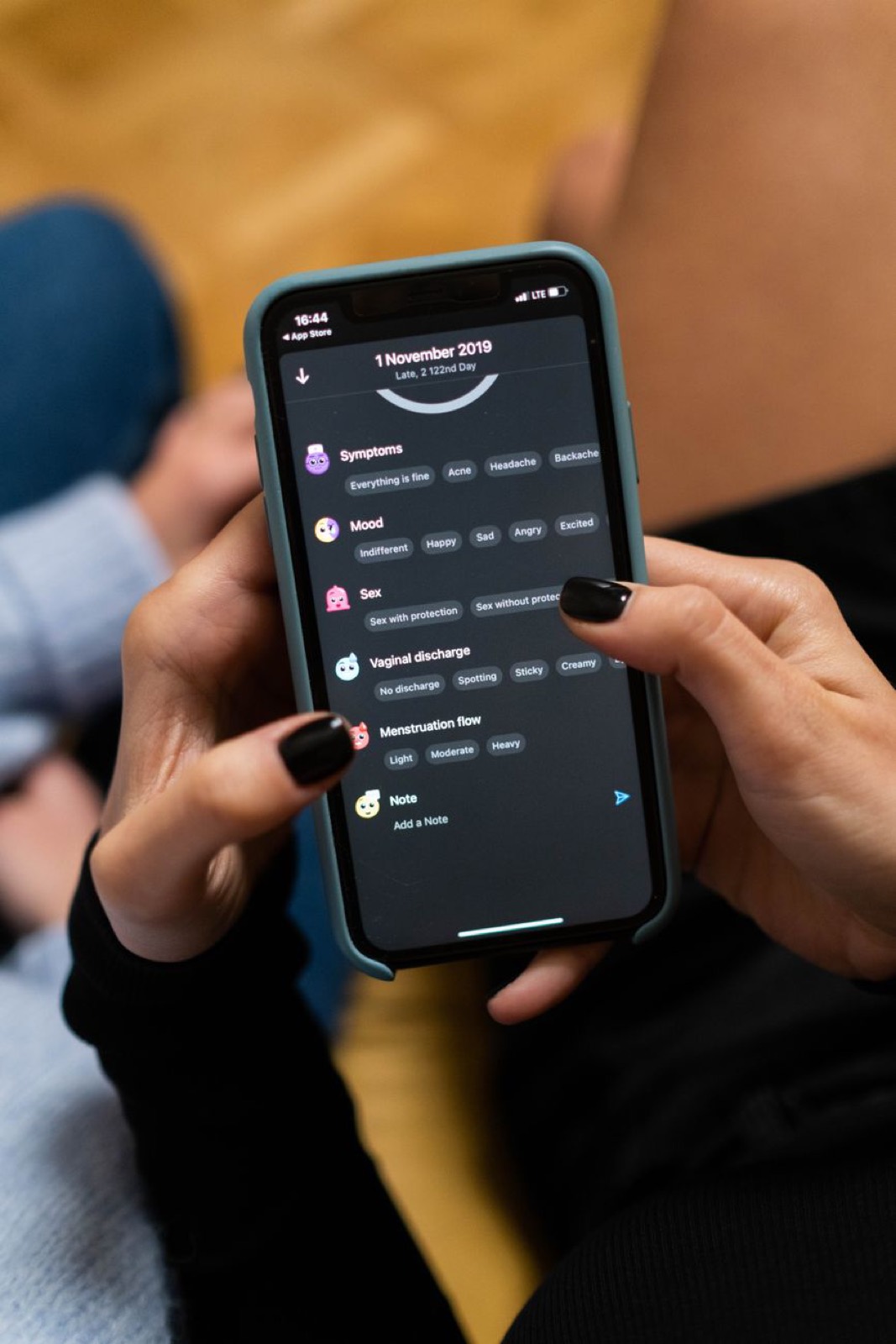 A phone showing a dark task app